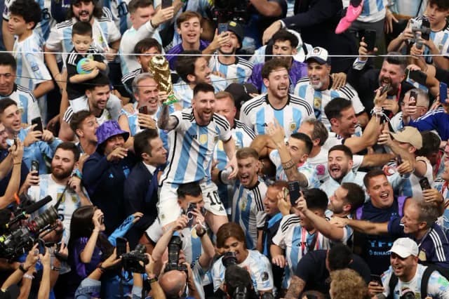Crowd cheering at a football stadium